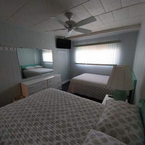 Second view of bedroom with two beds